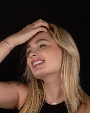 Sorriso de paciente da Clínica Viotto